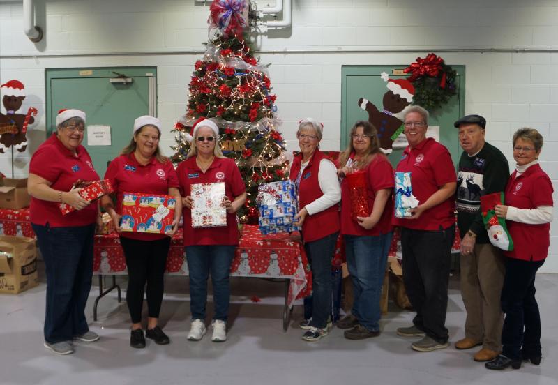 American Legion Post 17 Family members brighten the Army Reserve Center with a patriotic Christmas tree and gifts for the Reservists’ children. Shown are (l-r) Judi Hammond, co-chair of the auxiliary’s children and youth program; Anna Logan; Carol Cianflone; Auxiliary President Murt Foos; Cindy Butler; Dallas Butler; Sons Adjutant Tom Murray; and Auxiliary Chaplain Dorothy Murray. Volunteers not pictured are Sons Chaplain John Hammond, Sons Historian Dan Davis, Auxiliary Vice President Di Davis, Auxiliary Secretary Gail Sellazzo, Pat Schneider, and Karen and Vince Bernhard. SUBMITTED PHOTOS